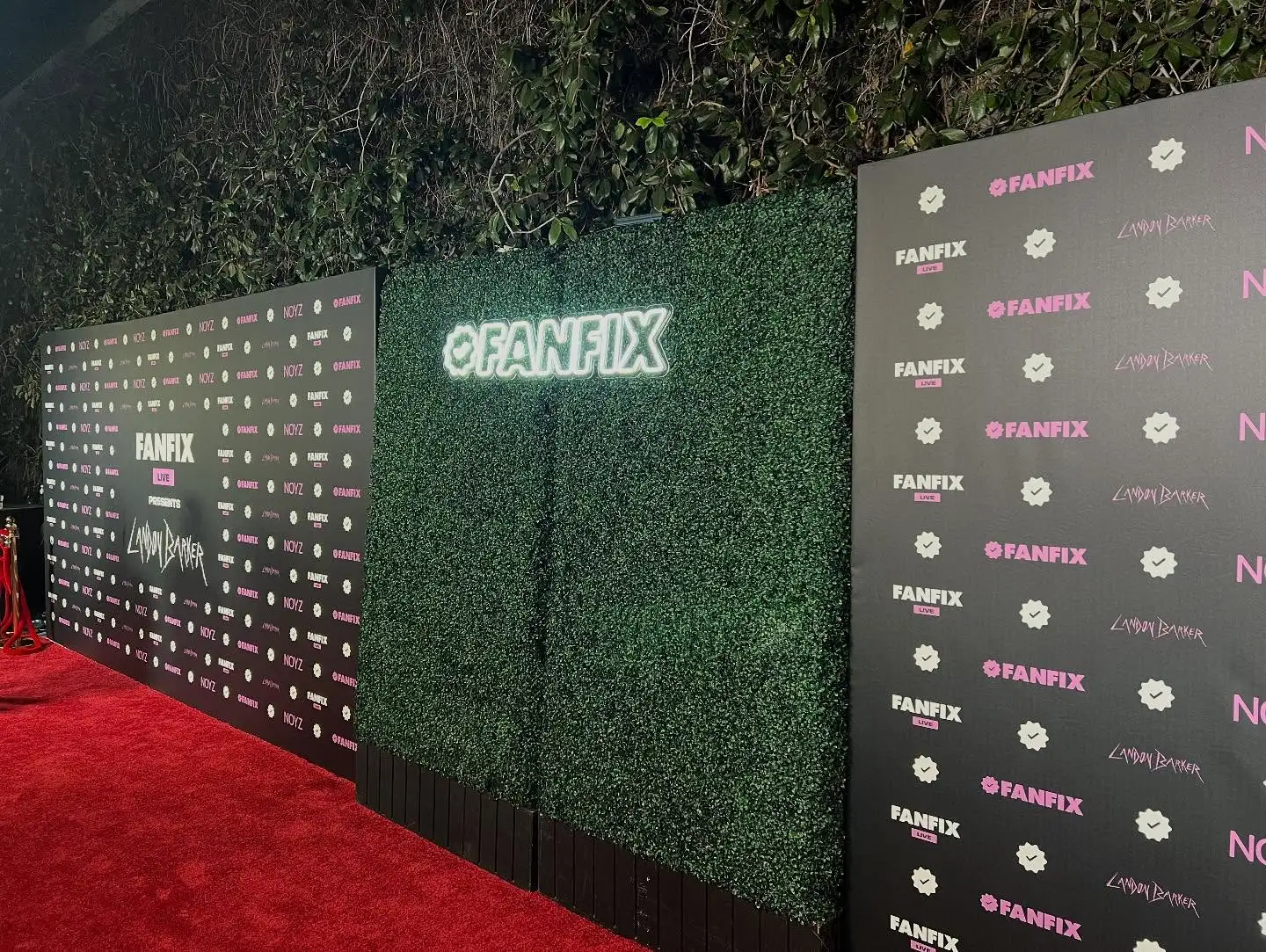 Red carpet step and repeat banner with sponsor logos at movie premiere event